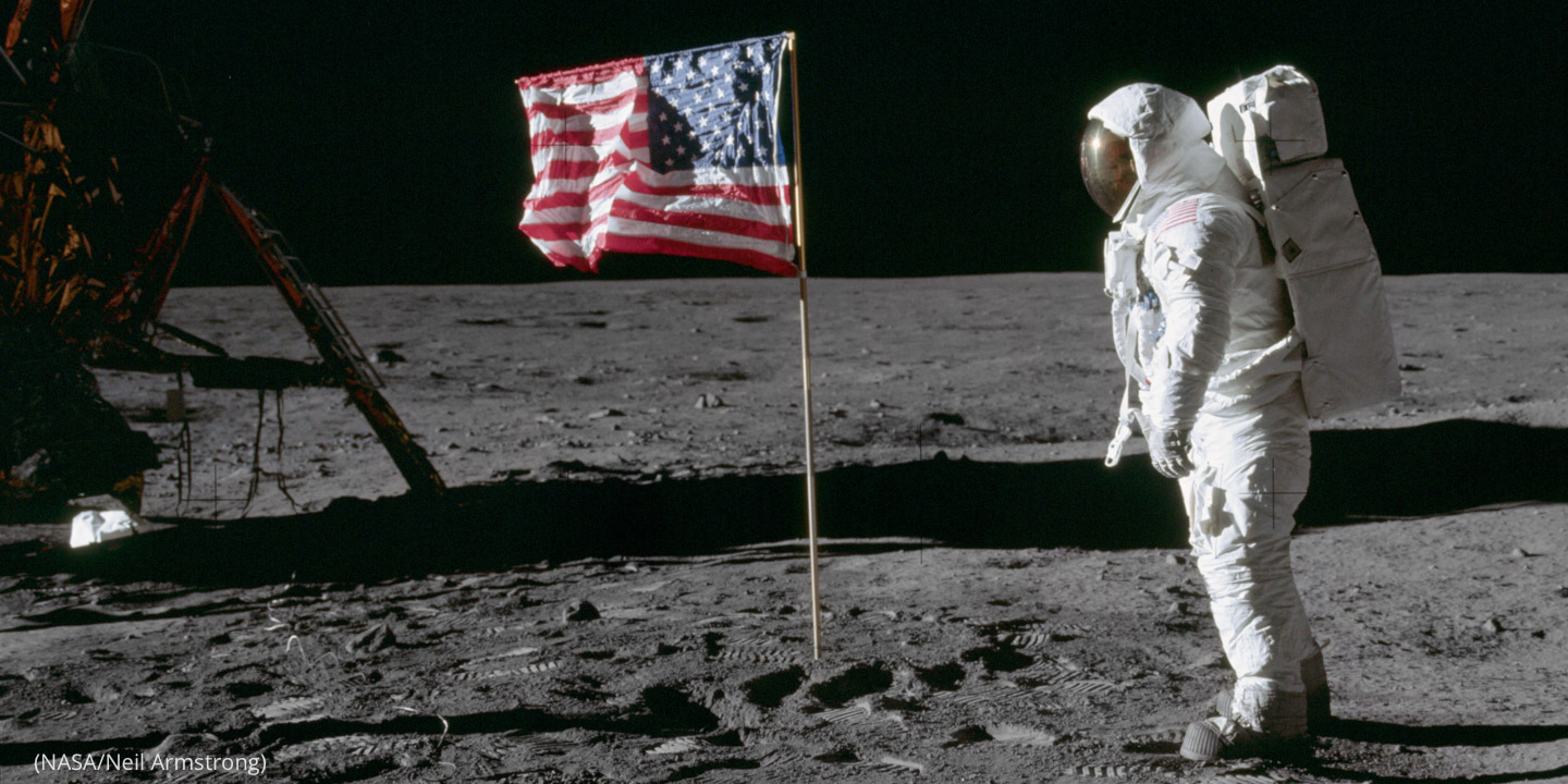 Astronaut Neil Armstrong on the Moon with American flag, July 20, 1969