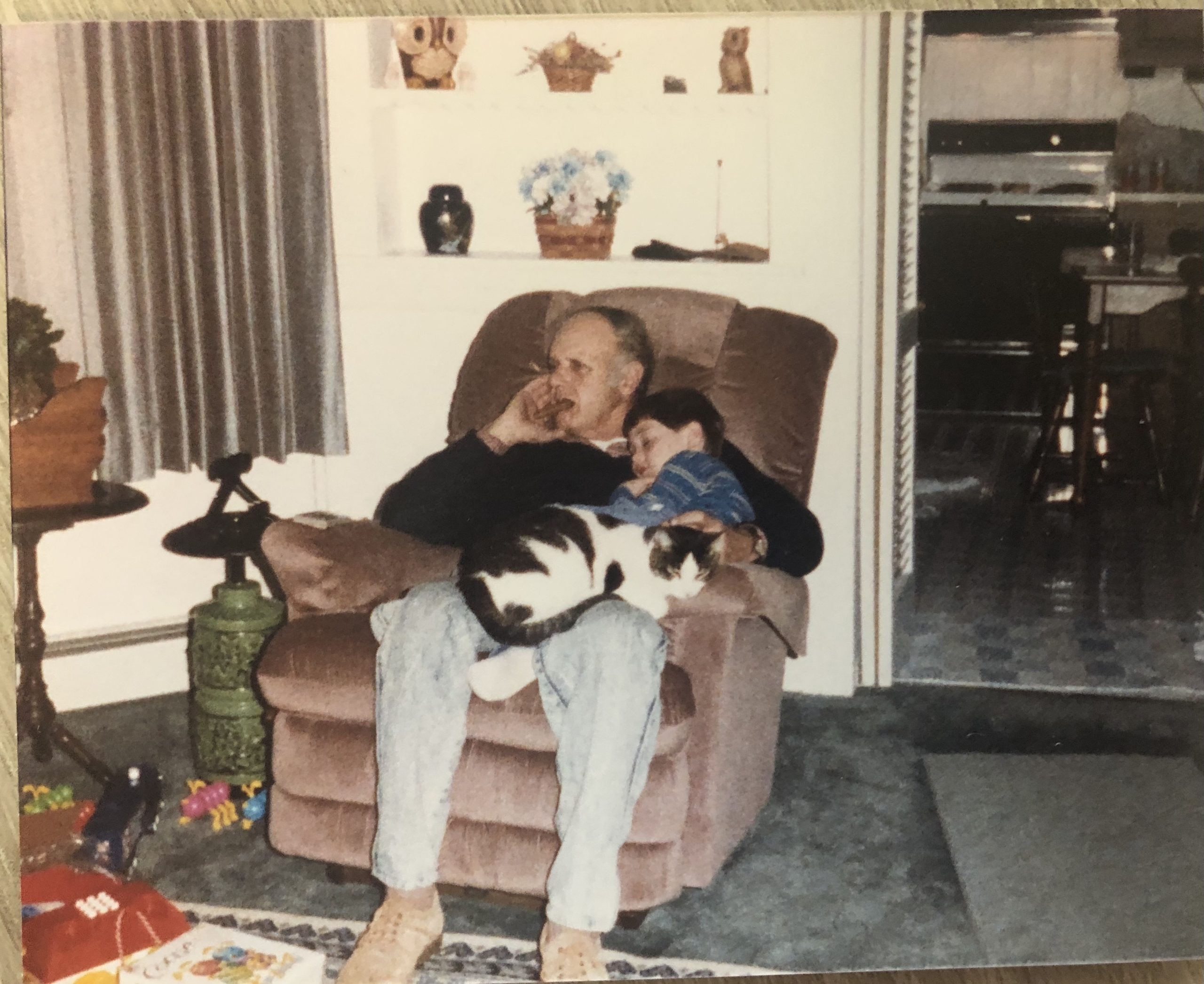 Young Ryan with his grandfather Dick Hann in a recliner